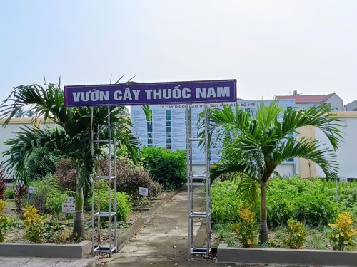 A sign with a ladder in front of a building

Description automatically generated